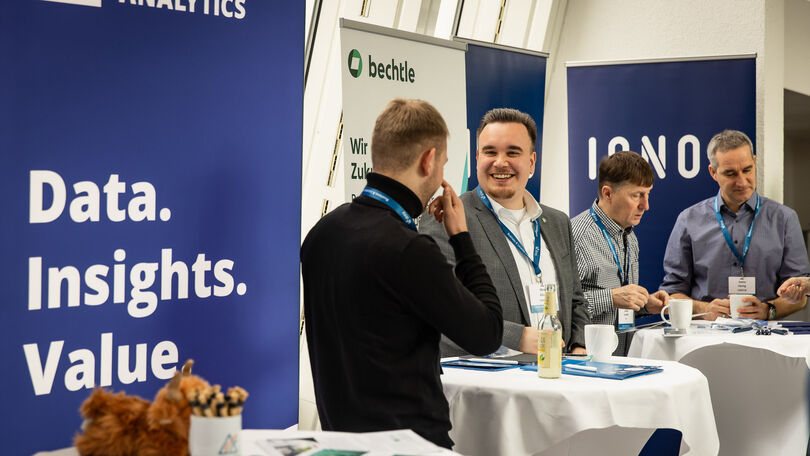 Vertreter der Disy-Partner im Gespräch an den Partnerständen während des Disy Werkstattgesprächs 2026.